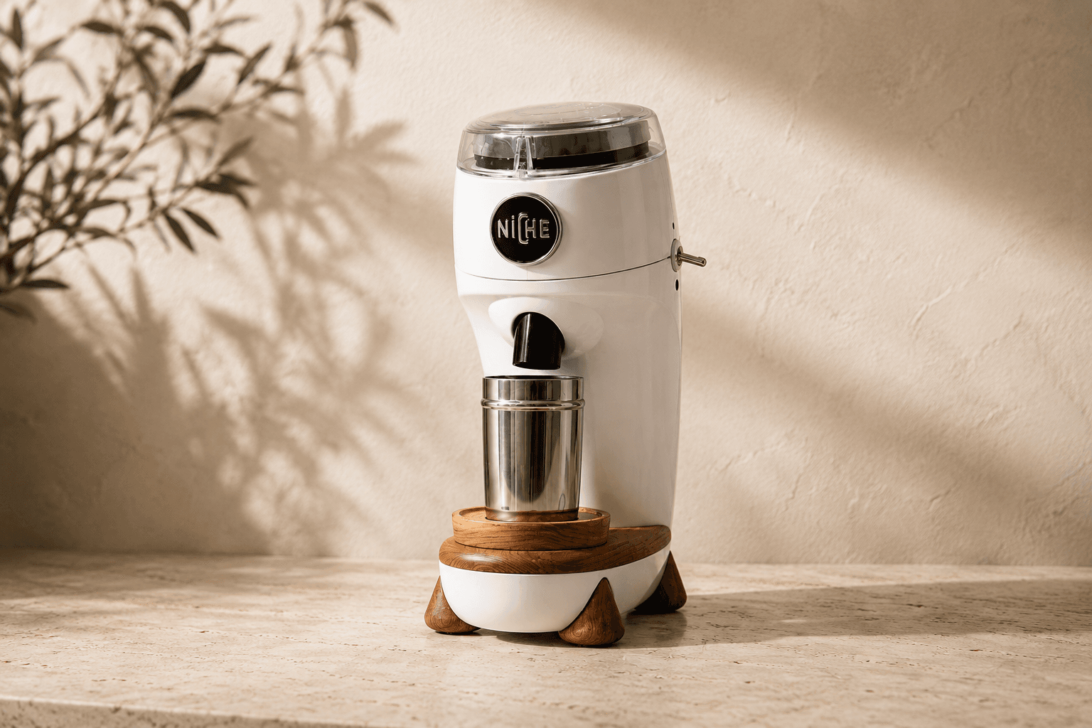 White Niche Zero grinder on a stone counter.